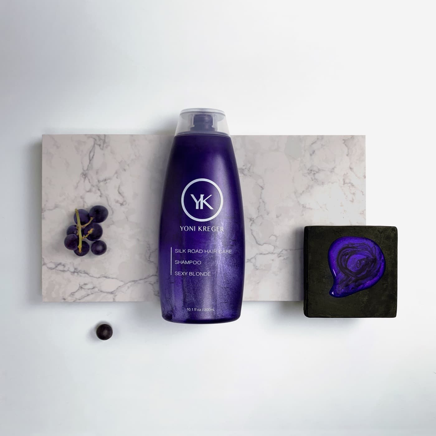 YK Silk Road Hair Care flat lay on marble